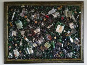 Collage with broken liquor bottles